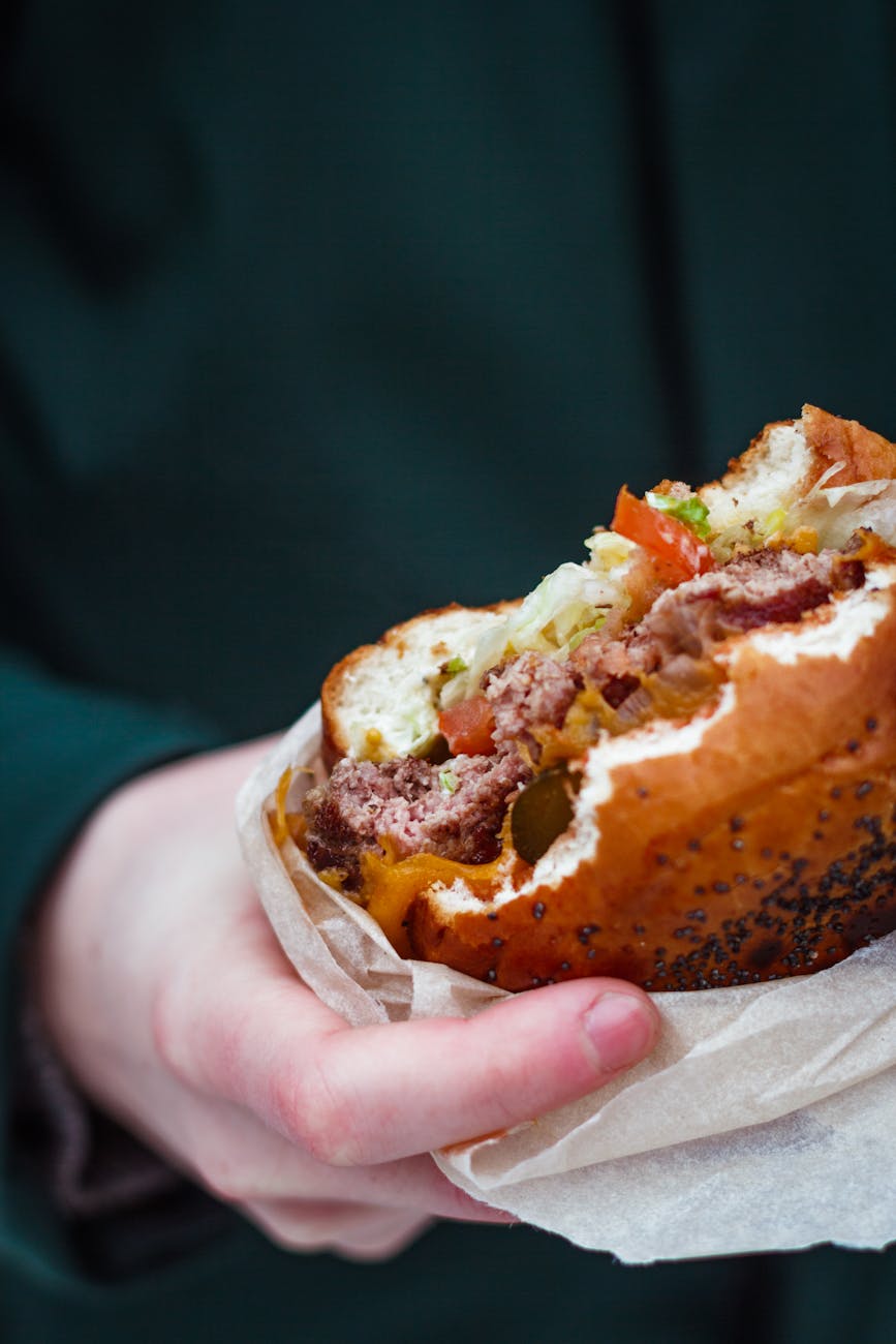 bitten hamburger with vegetables