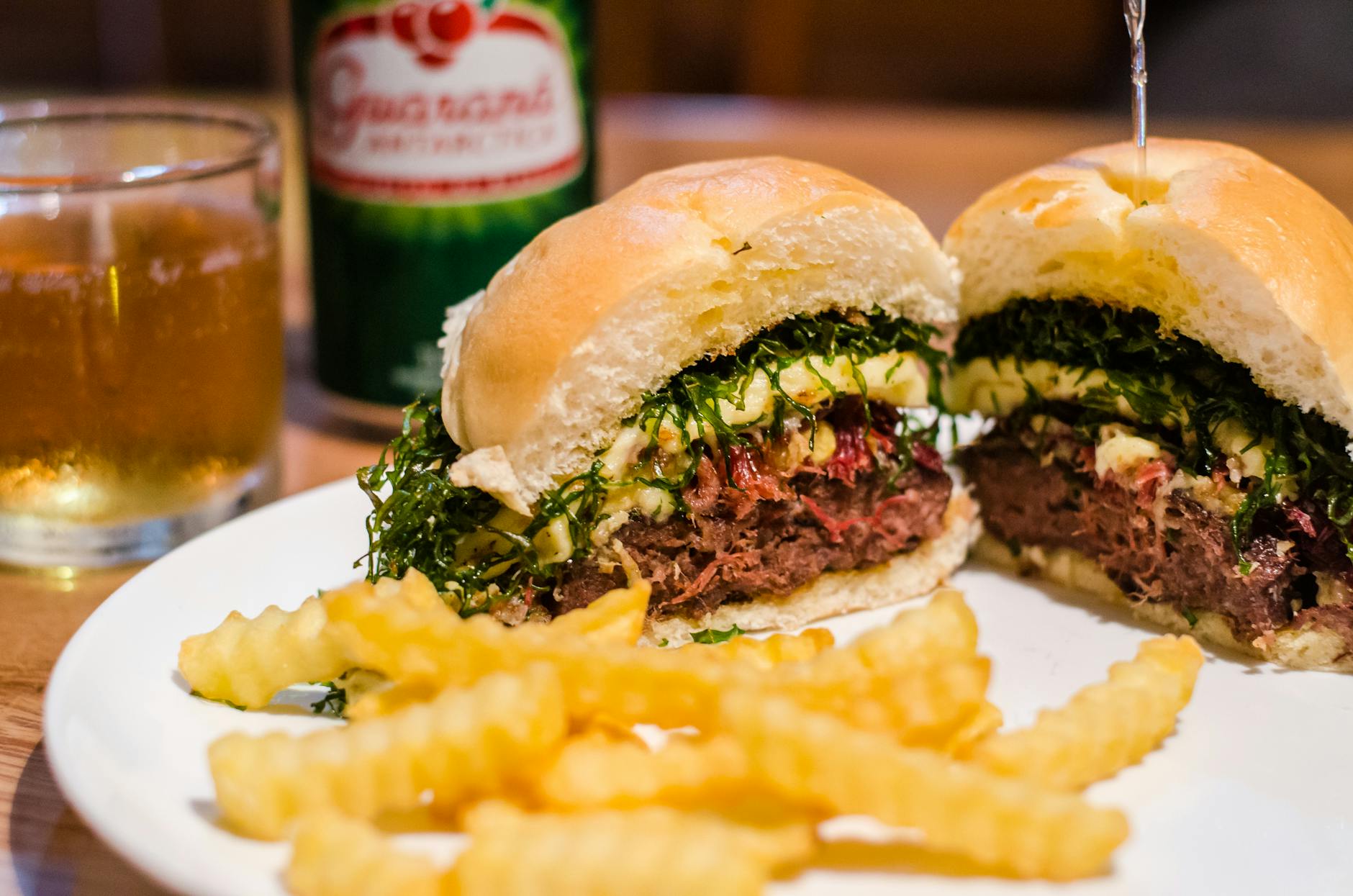 french fries and slice hamburger on plate